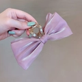 Detail of pink mesh fabric hair claw clip with elegant beaded pearls for voluminous hair - Iridescent Bow Pink