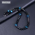 Detalle de collar de cuentas con ojo de tigre azul, ágata negra y hematita magnética - Ojo de Tigre Azul + Magnetita + Ágata Negra