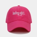 Detailed view of white gothic Babygirl embroidery on a rose red cotton baseball cap - Rose Red
