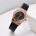 Detail of rose gold octagonal watch case with diamond inlay and black embossed strap - Black