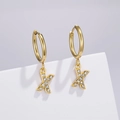 Detail of gold letter X hoop earrings with pavé zircon stones on a geometric stand - Letter X (Style: 0229)