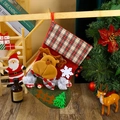 Close-up of red plaid Christmas stocking with 3D reindeer and tree on a cozy wooden stand - F4-3 New Large Fence Stocking - Reindeer