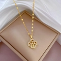 Gold titanium steel clover necklace with crystal inlay on beige box and white silk - Four Leaf Clover Pendant Gold (J130)