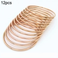 Set of 12 minimalist rose gold 3mm stainless steel bangles with a smooth mirror finish - Rose Gold (12-Piece Set)