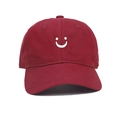 Kids cotton baseball cap in deep red featuring a white embroidered smiley face - Kids 52-54cm / Burgundy