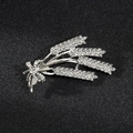 Detailed macro view of silver wheat brooch with shimmering crystal rhinestones - Wheat Silver
