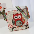 Ethnic canvas crossbody bag with red owl embroidery and colorful patterned strap - Owl
