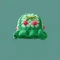 Handmade green crochet bucket hat featuring pink cherry patterns and leaf details - One Size / Cherry Dark Green