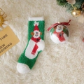 Green and white Christmas socks with snowman pattern in a festive gift ball package - Green Snowman