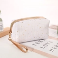 White star pattern cosmetic bag with gold zipper and handle strap for travel use - White