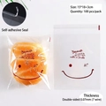Transparent self-adhesive bread bags with red smile face pattern, 15x18cm, 100 pieces - Brown Expression