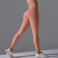 Seamless peach lift yoga pants in coral pink with high waist and scrunch butt design - Tropical Orange