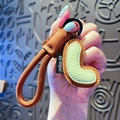 Creative letter J keychain in brown and green leather with woven strap for bags - Letter L