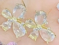 Elegant butterfly stud earring with light blue teardrop crystals and gold-plated finish - Gold Plated White Stone