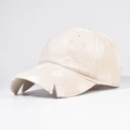 Close-up of distressed cream baseball cap featuring vintage frayed details and worn texture - Cream White (Washed Distressed)