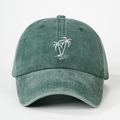 Close-up of embroidered white palm tree on washed green cotton baseball cap with curved brim - Dark Green
