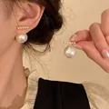 Elegant pearl drop earrings with horizontal row of small pearls on a warm background - E5893 Gold-Studs (Large Pearl Drop)