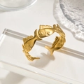 Polished gold-plated fish-shaped open cuff bracelet in minimalist display - Gold Fish Shoal