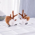Pair of brown reindeer antler hair clips with white plush balls on a mesh display - New Brown Antler Mink Fur Pair