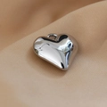 Macro view of silver heart pendant with mirror finish on soft beige silk background - 12# White K Heart