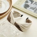 Detail of two-tone knotted satin headband in cream and brown on a vintage tray - Light Coffee and White