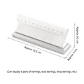 White faux leather earring display stand with silver metal base, holding 6 pairs - 12-Unit Earring Holder (White & Silver)