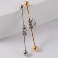 Industrial barbell piercing with five cubic zirconia stones in silver and gold finishes - NO 16 Gem Row