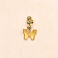 Detail van een gouden vlinder haarring met gele kristallen vleugels en fonkelende strass - Goud met geel stras