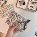 Close-up of floral cotton linen coin purse with a metal zipper and braided rope handle - Dark Grey Fine Leaf Small Flower