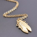 Macro detail of golden cicada pendant showing intricate wing textures on O-shaped chain - Pendant + 50cm Necklace / Gold