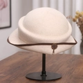 Detail of a vintage beige wool fedora featuring dark brown trim and a retro metal buckle - M(56-58cm) / Off White