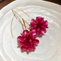 Macro shot of elegant rose red layered sequin flower drop earrings in a white ceramic dish - Hook-Fuchsia