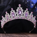 Close-up of sparkling purple crystals and rhinestones on a silver leaf-style bridal tiara - Silver White + Light Purple Diamond