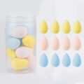 Macro detail of twelve multi-colored waterdrop makeup sponges in a transparent bucket container - 12Pcs Jar Yellow Pink Blue