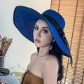 Blue woven straw sun hat with wide brim and black ribbon bow for beach vacations - One Size / Royal Blue with Black Trim