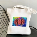 White canvas tote bag with colorful sun and moon surrealist art print on a metal chair - STD438-K (Surrealist Colorful Sun Moon Starry Sky)