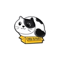 Cartoon enamel pin featuring a black and white cat sitting in a yellow box with text - This is Perfect Box Cat