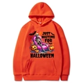 Orange Halloween hoodie featuring skeletons and pumpkins with Just Waiting For Halloween text - Orange