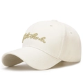 Off-white washed cotton baseball cap featuring elegant gold script embroidery on the front - Adjustable / Light Beige