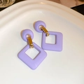 Macro shot of purple geometric acrylic earrings with gold clips on white ceramic tray - Purple Frosted Square Style (95#)