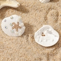 Detailed view of shell earrings with gold starfish, white pearls and colorful rhinestones - White K Shell Style (WEH5051)