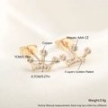 18k gold plated crown stud earrings with sparkling AAA zircon inlay on silk background - Crown