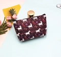 Flat lay of purple unicorn coin purse with tropical leaves and cute summer accessories - Unicorn-5