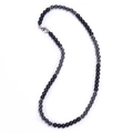 Close-up of 6mm matte black map stone necklace with silver metallic spacer beads - Matte + Black Magnetite Necklace