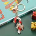 Golden Christmas candy cane keychain with sparkling rhinestones and festive red bow charm - Candy Cane