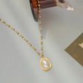 Golden titanium steel necklace with baroque pearl pendant and alternating bead chain links - Necklace / Gold