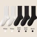 Five pairs of ribbed cotton crew socks in white, dark grey, and black classic colors - One Size