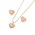 Golden necklace and earring set featuring pearlescent pink heart pendants on white background - Pink