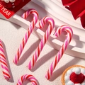 Close-up of pink and red striped Christmas candy canes for DIY crafts and decor - Red and Rose Red Striped