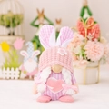 Pink Easter gnome plush with bunny ears and white braids for festive spring decor - Pink Female Heart Style